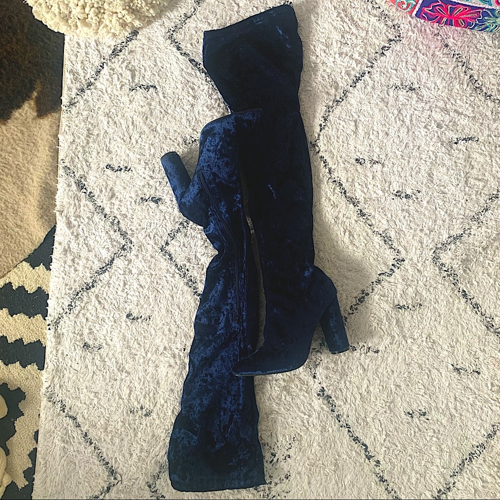 Blue velvet over the knee boots with pointed toe.